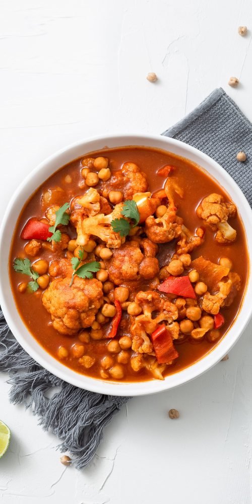 vertical-shot-chickpea-curry-chana-masala-with-lime-bowl-white-surf